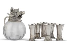 758.  Juego de jarra de cristal con tapa de metal plaeado rematada por cabeza de jabalí y seis copas de metal plateado.Valentí, España, segunda mitad del S. XX.