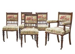 576.  Juego de doce sillas de comedor de madera tallada y una silla de brazos.Francia, h. 1900.