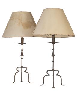 655.  Pareja de hacheros sobre pies de trípode de hierro transformados en lámparas.España, S. XIX.