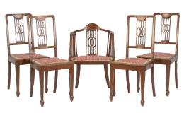 769.  Cuatro sillas modernistas de madera tallada y una butaca.España, h. 1930.