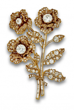 72.  Elegante broche de brillantes con diseño floral en oro de 18K.