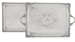 693.  Lote de dos bandejas rectangulares de plata: Una con palmetas en el perímetro, de ley 916 marcada Marabini, S. XX.Otra con asas e iniciales grabadas, con marcas de B. López, Madrid, h. 1900.