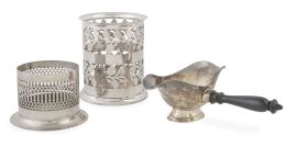 1255.  Lote de tres piezas: salsera de metal plateado con mango de madera, soporte para botellas inglés de metal plateado con decoración calada y otro soporte de alpaca con hojas.S. XX.
