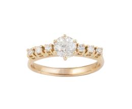 193.  Sortija francesa con brillante elevado de 0,60 ct aprox. engastado en seis garras y flanqueado por trío de brillantes