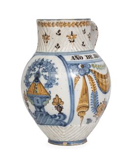1158.  Jarra de cerámica esmaltada con la Virgen del Prado y decoración de pabellones, con nombre: "Modesta Diaz" y leyenda "Año de 1865". Talavera, fechada 1865.