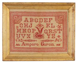 1426.  Bordado con abecedario, ave y firma "Amparo García" en hilo rojo.Fechado año 1920.