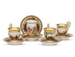 1246.  Juego de trece tazas  Carlos X con cinco platos y un florero de porcelana esmaltada con arquitecturas y árboles.Paris, h. 1830