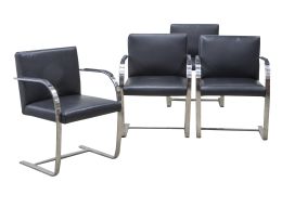 1424.  Lote de cuatro sillas Brno en acero y piel negra.Según diseño de Mies van der Rohe (1886 - 1969), Vitra.