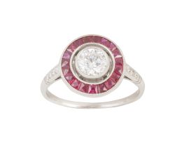 346.  Sortija ojo de perdiz con brillante central de 0,65 ct aprox. orlado de rubíes de talla francesa