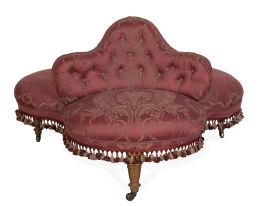 673.  "Divan de milieu" con tapicería capitoné en rosa y borlas.Francia, finales del S. XIX.