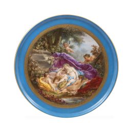 1246.  Plato de porcelana esmaltada y dorada a la manera de Sévres