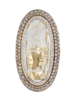 219.  Gran sortija lanzadera con piedra central oval facetada y doble orla de brillantes y brillantes brown