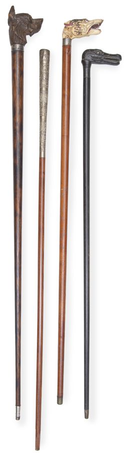 1103.  Lote de cuatro bastones, tres de ellos con empuñaduras zoomorfas.Finales del S. XIX - principios del S. XX.