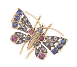21.  Broche mariposa de pp. S. XX con zafiros, rubíes y brillantes de talla antigua