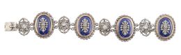 26.  Brazalete portugués de plata, marcasitas y esmalte azul, con diseño de cuatro medallones ovales unidos por óvalos calados con marcasitas y circonita central