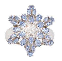 346.  Sortija con diseño de estrella con centro cuajado de brillantes y topacios azules en talla perilla, oval y marquisse
