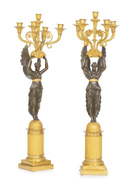 1067.  Pareja de candelabros imperio de bronce dorado y pavonado c