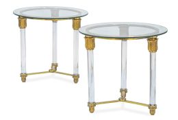 583.  Pareja de mesas auxiliares de metacrilato y metal dorado con tapa circular de cristal.Años 90.
