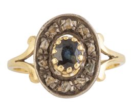 30.  Sortija portuguesa de pp. S. XX, con diseño oval de zafiro enmarcado en diamantes
