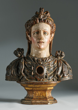 1038.  Escuela castellana romanista, S. XVIIBusto relicario, Santa LucíaDe madera tallada, estucada y esgrafiada..