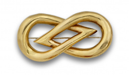 109.  Broche nudo en oro de 18K.