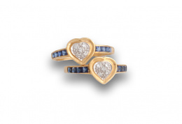 90.  Sortija con corazón de pavé de brillantes y zafiros calibrados en la montura.