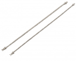 527.  Pulsera rivière de brillantes montados en garras de oro blanco de 18K.