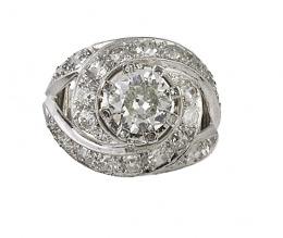 554.  Sortija bombée años 30 de brillantes de talla antigua con brillante central 1,5 ct aprox rodeado de espirales de brillantes