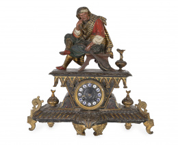 1041.  Reloj de sobremesa en metal pintado en frío y dorado.Ff. S. XIX