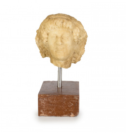 589.  BacoCabeza de mármol tallada.Trabajo Romano, s. I-II D.C..