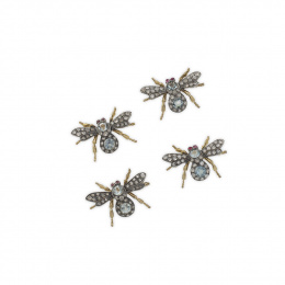 649.  Conjunto de cuatro broches en forma de moscas con cuerpo de aguamarinas, alas de brillantes y ojos de rubí