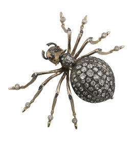 600.  Gran broche años 30 en forma de araña con cuerpo cuajado de brillantes de talla antigua y ojos de rubí 