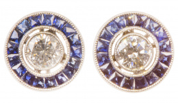 294.  Pendientes ojos de perdiz con brillante central orlado de zafiros