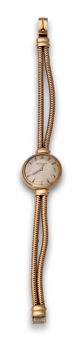 737.  Reloj de pulsera para señora JAEGER LE COULTRE años 50 en oro de 18K.