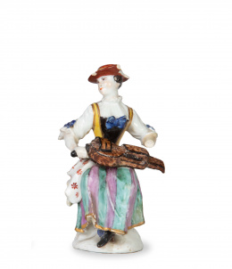 1306.  Dama con instrumento.Figura de porcelana esmaltada.S. XVIII.
