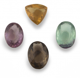 249.  Lote de cuatro piedras finas formado por: amatista oval,cuarzo ahumado oval, fluorita oval y citrino triangular