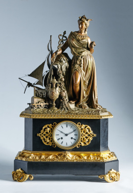 1000.  Reloj de sobremesa en mármol, calamina y bronce dorado, con grupo escultórico, que hace alusión a la Revolución Industrial.Trabajo francés, mediados del S. XIX