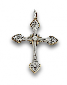 606.  Cruz pps s XX con bte de 0,20 ctes aprox y diamantes en oro de 18K con frente de platino.