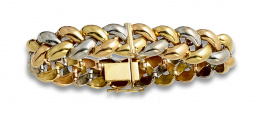 785.  Brazalete en forma de trenza en oro blanco y amarillo de 18K.