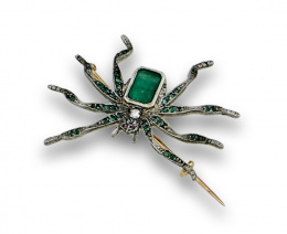 14.  Broche araña Art-Decó con centro de esmeralda ,patas con esmeraldas y ojos de rubí.