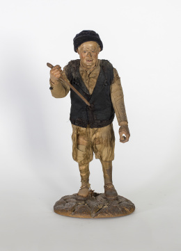 1052.  “Campesino”Figura de belén napolitano en madera tallada y estopa.Nápoles, S. XVIII - XIX.
