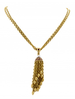 203.  Collar largo con centro de borla colgante de la firma ZANCAN en oro de 18K. con rubíes y brillantes.