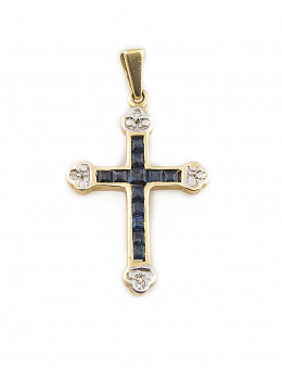 176.  Cruz colgante de zafiros calibrados con remates lobulados de brillantes