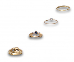 152.  Cuatro anillos con: zafiro y circonitas, ciconita central ,aro gallonado y nudo respectivamente.