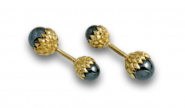 750.  Gemelos TIFFANY & CO de la collección SCHLUMBERGER con dobles esferas de hematites en montura rígida a modo de delicada bellota en oro de 18K.