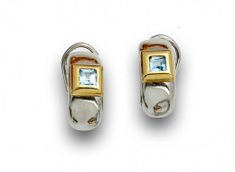 783.  Pendientes aro con topacios azules en oro bicolor de 18K.