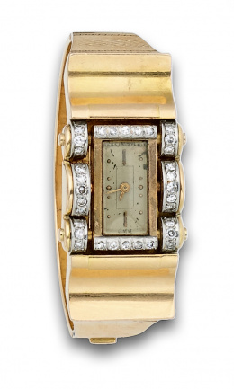 227.  Reloj años 40 PATEK PHILLIPE con elegante pulsera chevaliere de brillantes y oro de 18K.