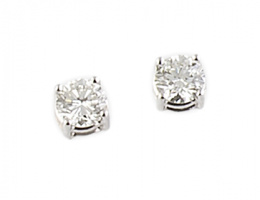 210.  Pendientes dormilonas con brillantes en montados en cuatro garras de oro blanco de 18K