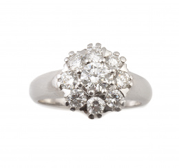 536.  Sortija rosetón con un brillante central de 0,47 ct rodeado por ocho brillantes