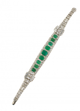 557.  Elegante pulsera articulada de esmeraldas,diamantes talla baguette y brillantes